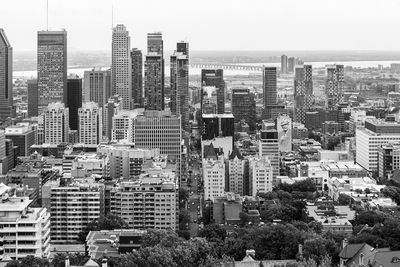 High angle view of buildings in city against sky