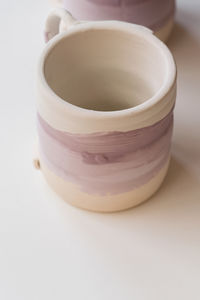 Painted pink ceramic cup