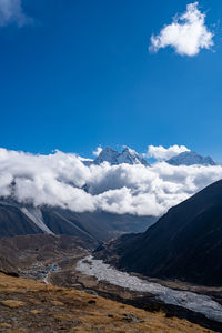 Scenic view of snowcapped mountains against sky