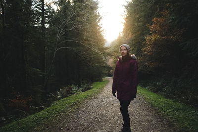 Woman standing in forest