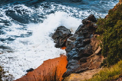 High angle view of water flowing through rocks