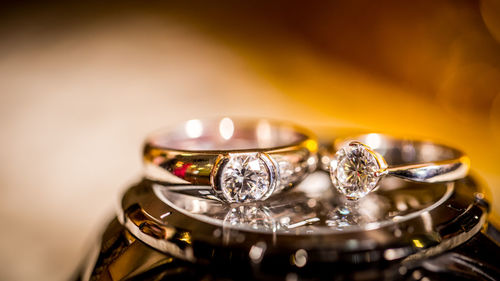 Close-up of wedding rings on watch