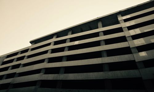 Low angle view of office building against sky