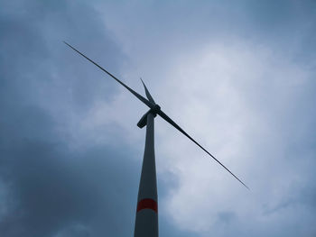 Low angle view of windmill against sky