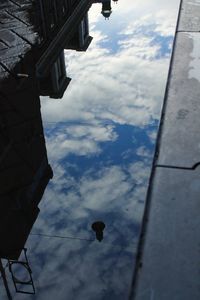 Low angle view of built structure against cloudy sky