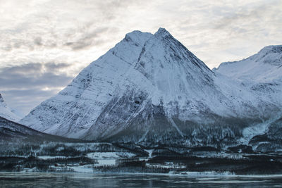 Scenic view of snowcapped mountains against sky