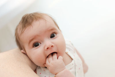 Lovely baby sucking hand