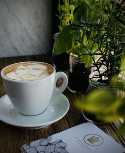 Coffee and cup on table