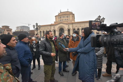 Group of people in front of building