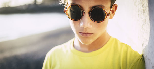 Close-up of teenage boy wearing sunglasses
