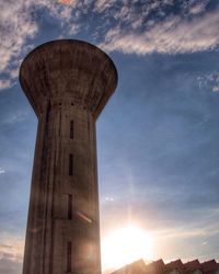 Low angle view of built structure against sunset