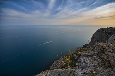 Scenic view of sea against sky at sunset