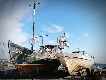 Low angle view of ship moored against sky