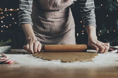 Midsection of woman preparing food