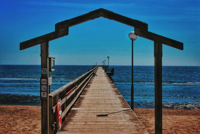 Pier over sea against sky