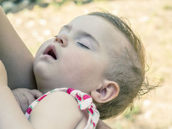 Close-up of young woman with eyes closed