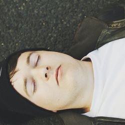 High angle view of man sleeping on street