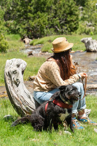 Woman sitting on field