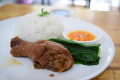 Close-up of fish served in plate on table