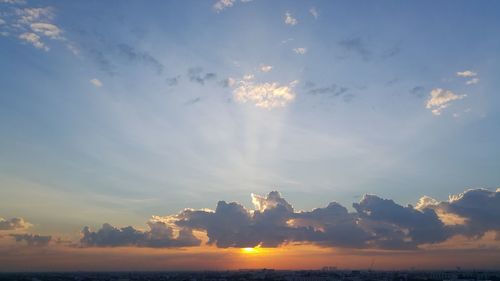 Scenic view of landscape against sky at sunset