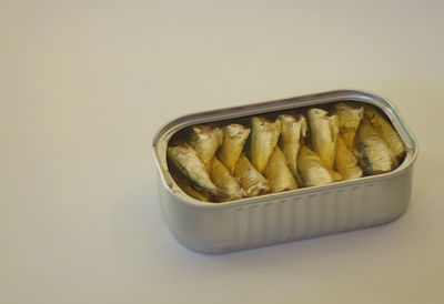 Close-up of pasta in bowl against white background