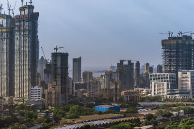 Modern buildings in city against sky
