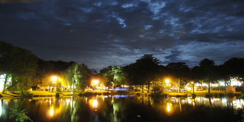 Scenic view of river against sky at night