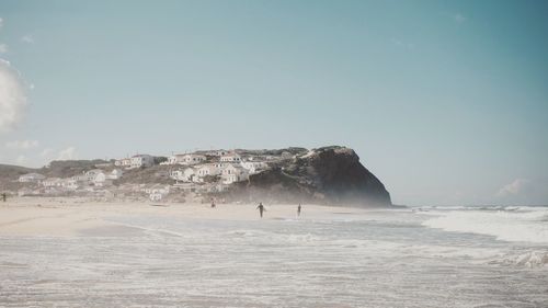 Scenic view of beach against sky