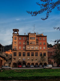 View of buildings against cloudy sky