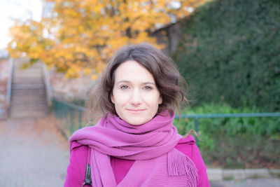 Portrait of young woman wearing purple shawl