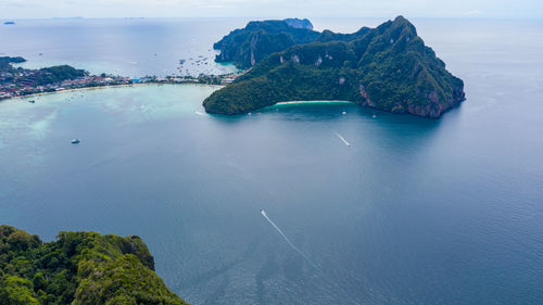 High angle view of sea and trees against sky