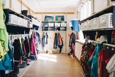 Various clothes hanging in cloakroom at preschool