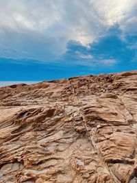 Rock formations on land against sky