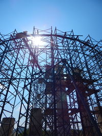 Low angle view of metal structure against sky