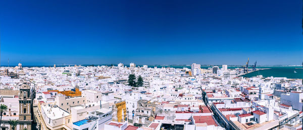 High angle view of townscape against blue sky