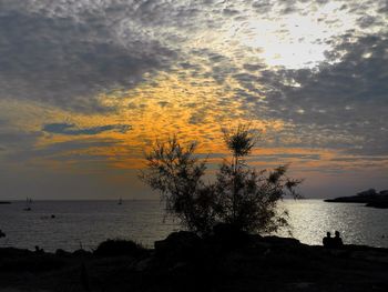 Scenic view of sea at sunset