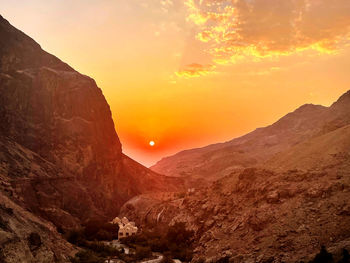 Scenic view of mountains against sky during sunset