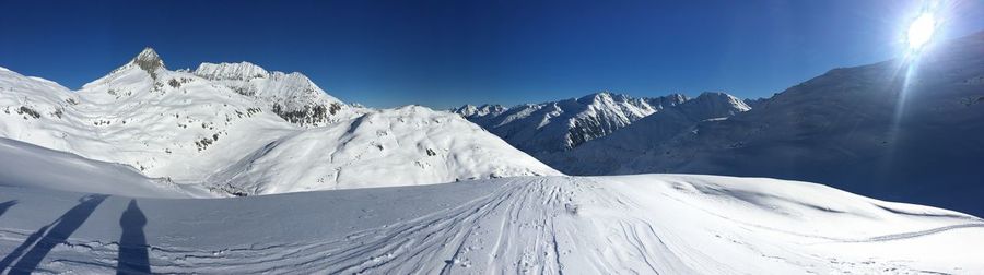 Scenic view of snowcapped mountains against sky