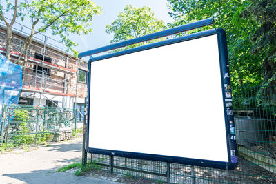 Low angle view of empty park against clear sky