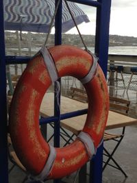 Close-up of red chairs in water