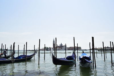 Boats moored in canal