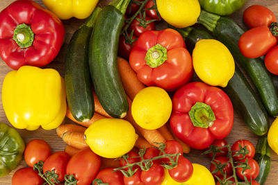 Vegetables on top of a brown wood background