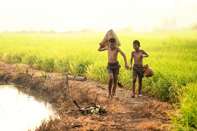 Boys walking on field