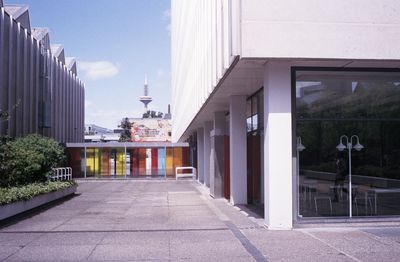 Street leading towards buildings in city