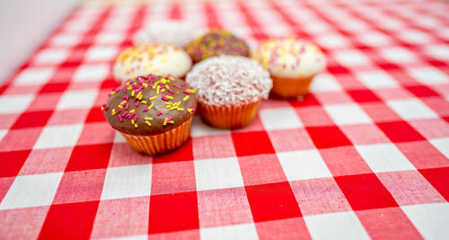 Close-up of multi colored candies on table