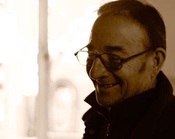 Close-up of smiling man wearing eyeglasses