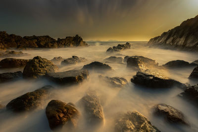 Panoramic view of sea against sky during sunset