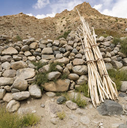 Stone wall on mountain against sky