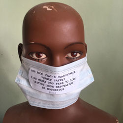 Portrait of teenage girl against wall