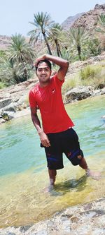 Portrait of smiling young man on beach